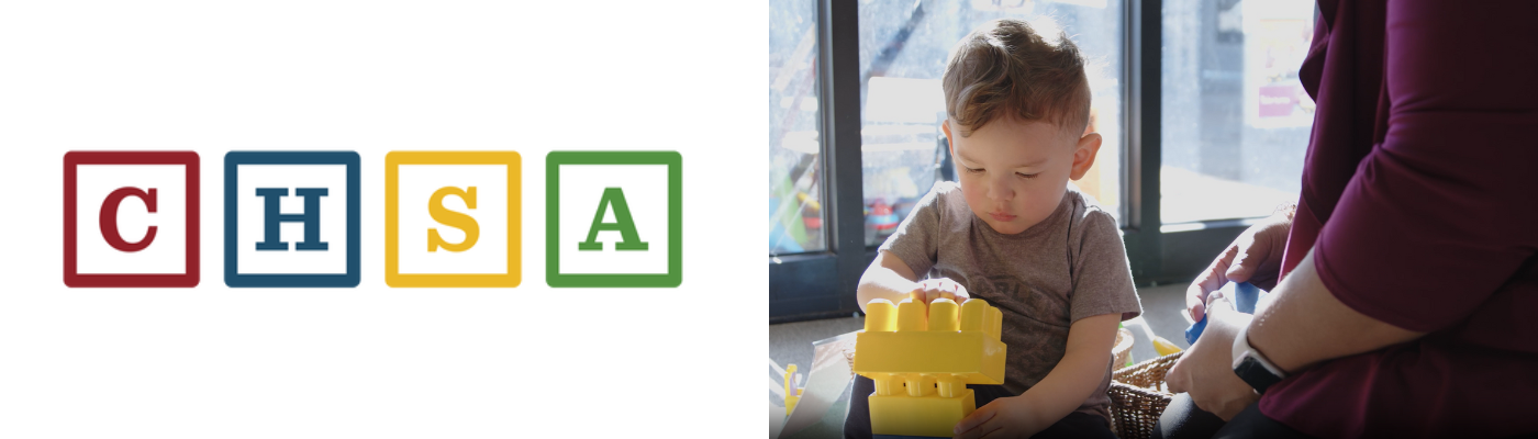 The Colorado Head Start Association (CHSA) logo, featuring the letters C, H, S, and A, each centered within a colored, square building block (C is red, H is blue, S is yellow, A is green). To the right, a photograph shows a toddler with light hair sitting and focusing intently on stacking yellow plastic blocks, with a partial view of an adult sitting next to him.